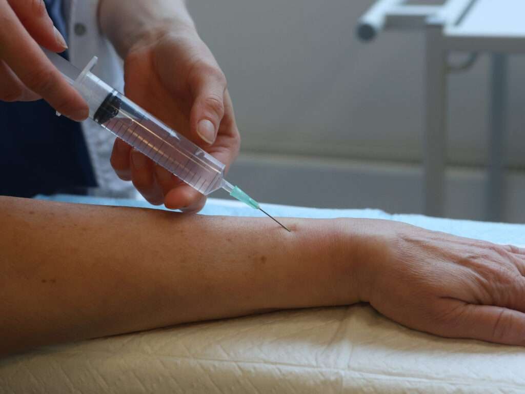 Close-up of an arm receiving an injection