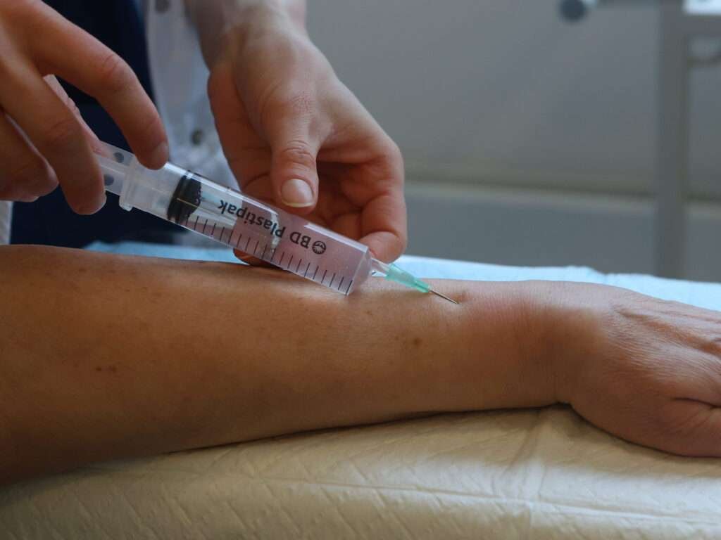 Syringe injection into forearm