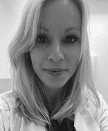 Black and white portrait of woman smiling.